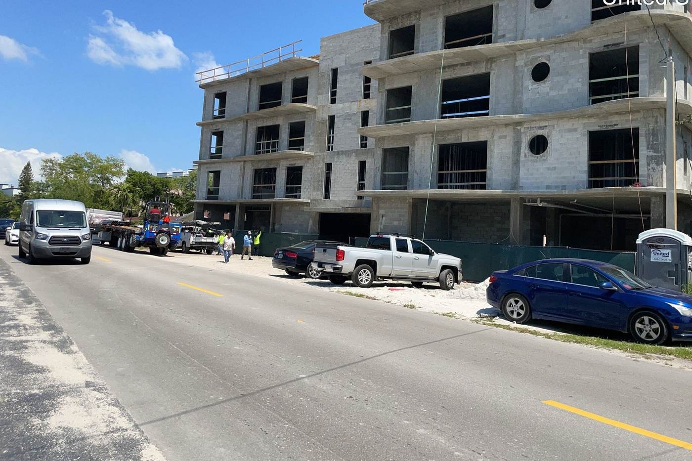Exterior facade work and scaffold setup on a residential project